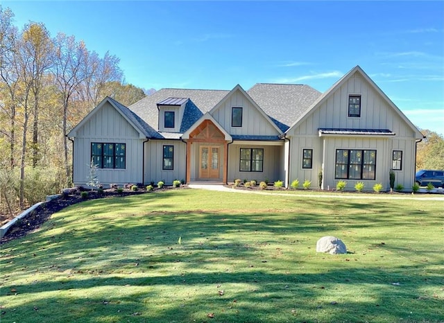 modern farmhouse style home featuring french doors and a front lawn