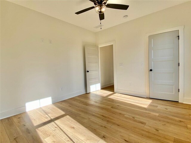 9224 Waldrip Rd, Gainesville, GA 30506 - empty room with light wood-type flooring, ceiling fan, and baseboards