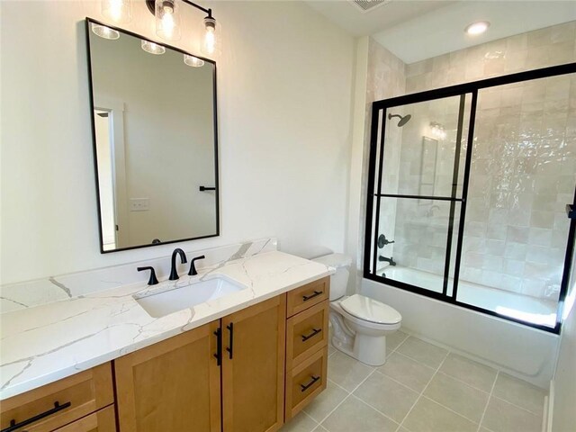 9224 Waldrip Rd, Gainesville, GA 30506 - bathroom featuring vanity, toilet, bath / shower combo with glass door, and tile patterned flooring