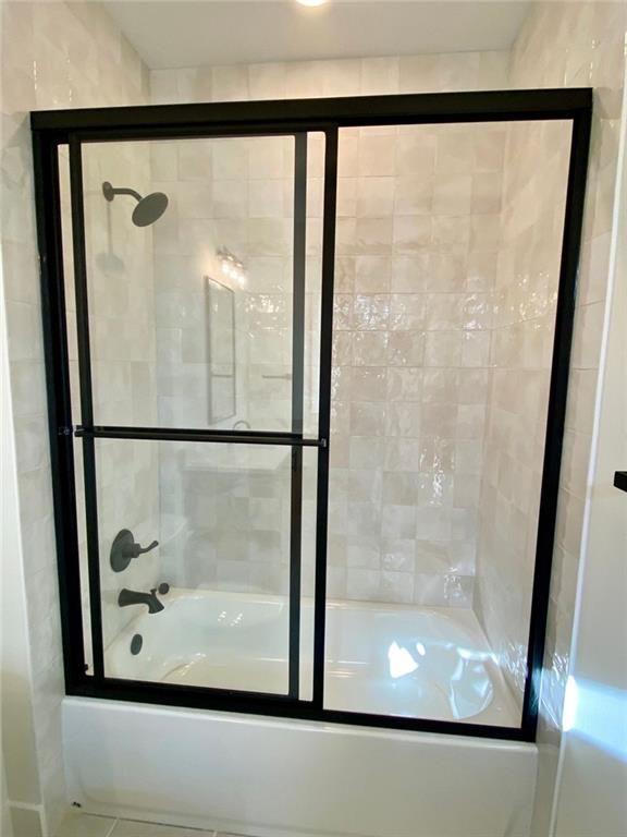 9224 Waldrip Rd, Gainesville, GA 30506 - bathroom with bath / shower combo with glass door