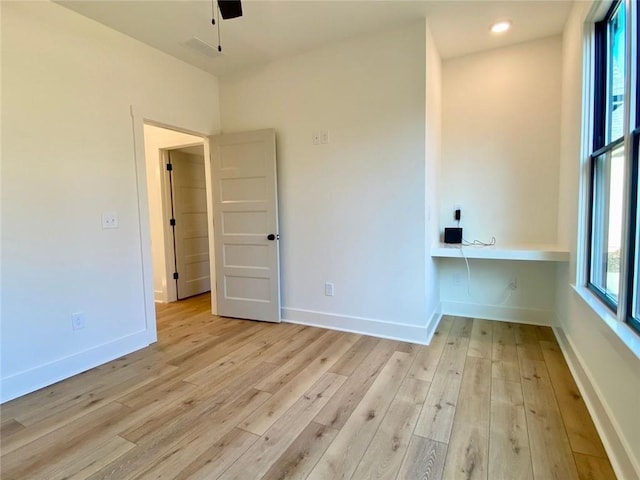 9224 Waldrip Rd, Gainesville, GA 30506 - spare room with light wood-type flooring, a ceiling fan, and baseboards