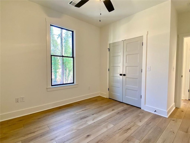 9224 Waldrip Rd, Gainesville, GA 30506 - unfurnished bedroom featuring baseboards, light wood finished floors, a closet, and ceiling fan
