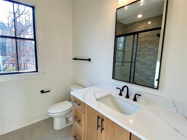 9224 Waldrip Rd, Gainesville, GA 30506 - full bath with tile patterned floors, vanity, toilet, a shower stall, and healthy amount of natural light
