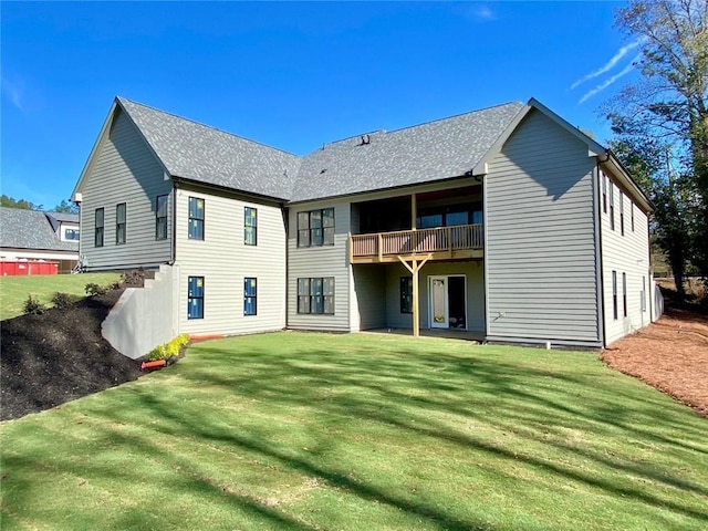 9224 Waldrip Rd, Gainesville, GA 30506 - back of property with a yard, a shingled roof, and a balcony