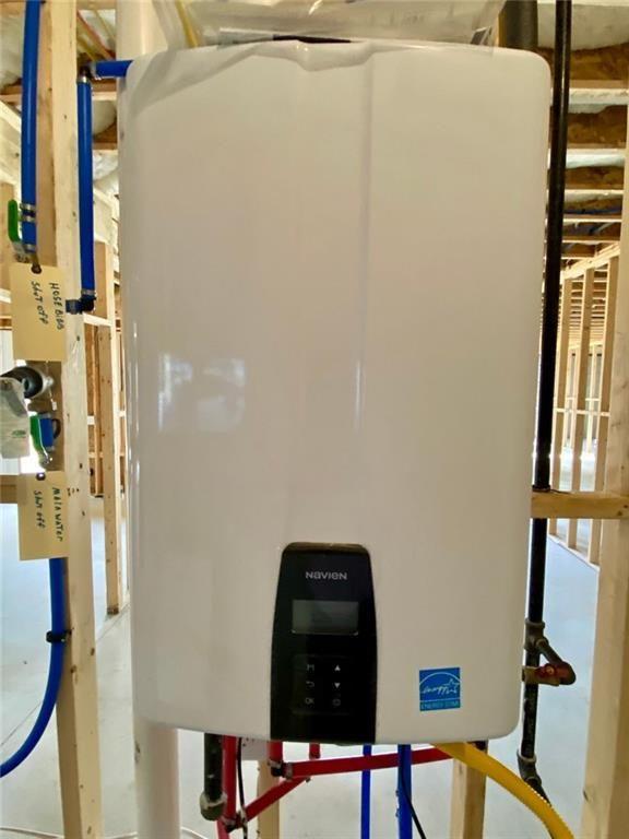 9224 Waldrip Rd, Gainesville, GA 30506 - utility room featuring tankless water heater