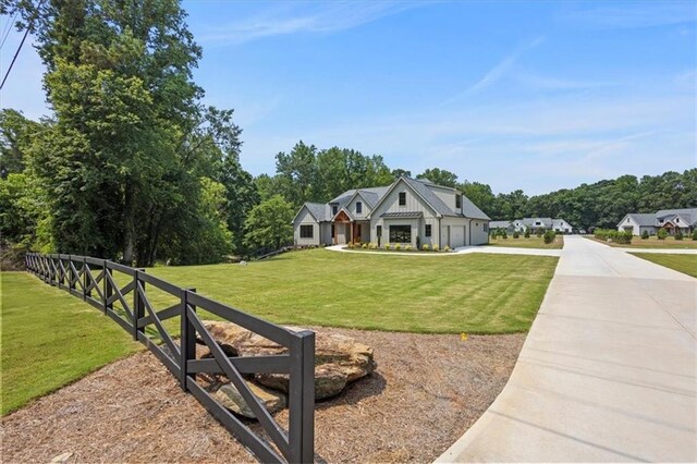 9224 Waldrip Rd, Gainesville, GA 30506 - modern farmhouse style home featuring driveway, a garage, and board and batten siding