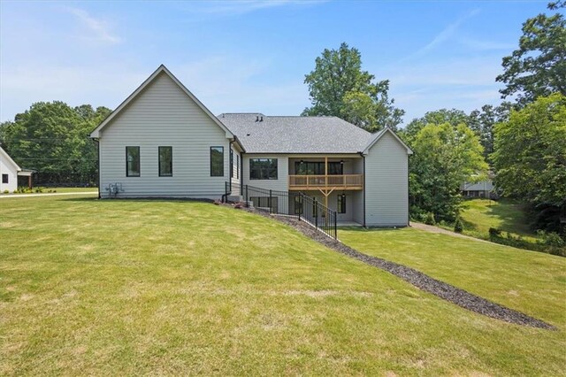 9224 Waldrip Rd, Gainesville, GA 30506 - back of property featuring a yard, a deck, stairs, and a shingled roof