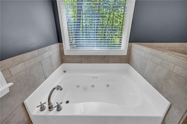 full bath featuring a whirlpool tub