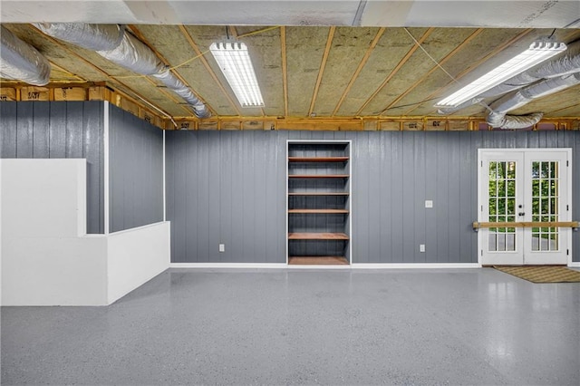unfurnished room with baseboards and speckled floor