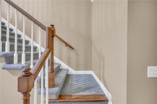 stairway with baseboards