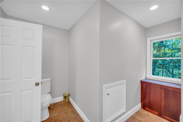bathroom featuring recessed lighting, baseboards, tile patterned flooring, and toilet