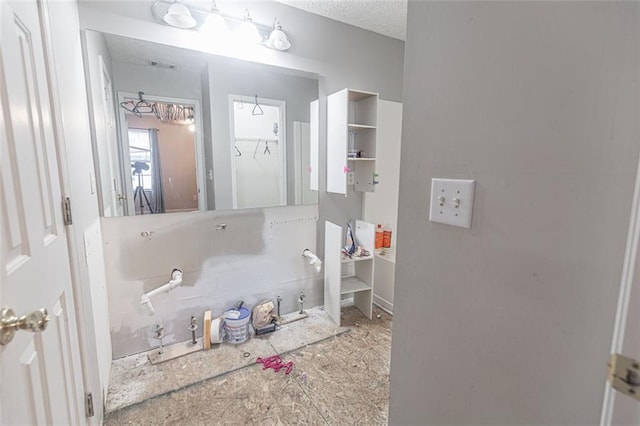 bathroom featuring a textured ceiling