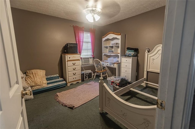 carpeted bedroom with a textured ceiling and ceiling fan