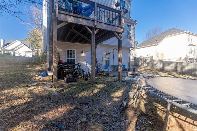 rear view of property with a wooden deck