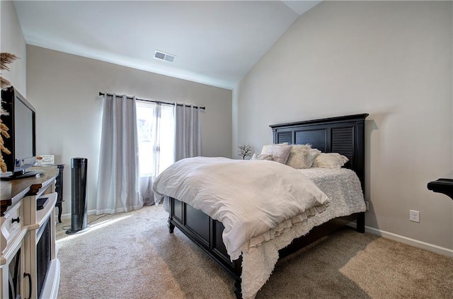 carpeted bedroom featuring vaulted ceiling