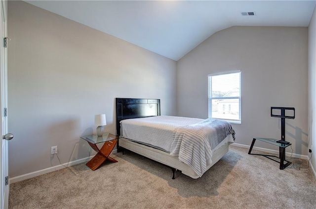 carpeted bedroom featuring vaulted ceiling