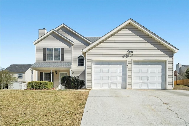 traditional-style home with concrete driveway, a front lawn, a chimney, and an attached garage