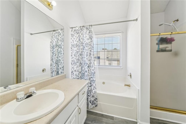 full bathroom with a shower with curtain, wood finished floors, vanity, and a bathing tub