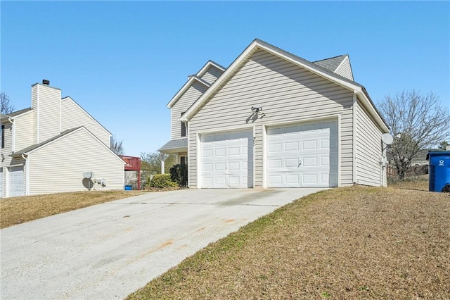 exterior space featuring a garage and concrete driveway