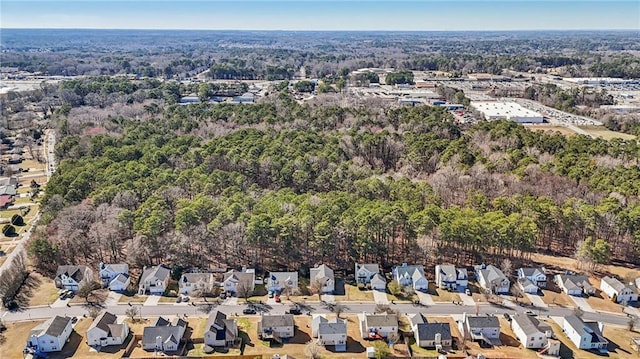 aerial view with a residential view and a wooded view