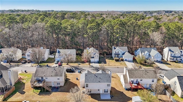 aerial view featuring a residential view and a wooded view