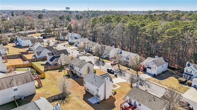 aerial view with a residential view and a view of trees