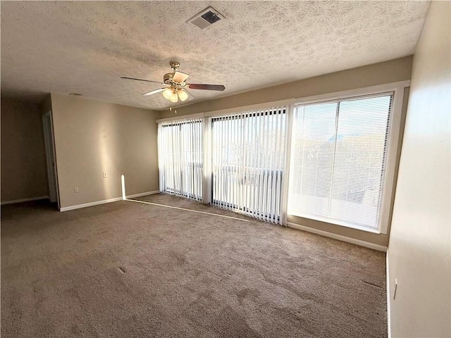 296 Country Club Dr, Jonesboro, GA 30238 - carpeted empty room featuring a textured ceiling, a ceiling fan, and baseboards