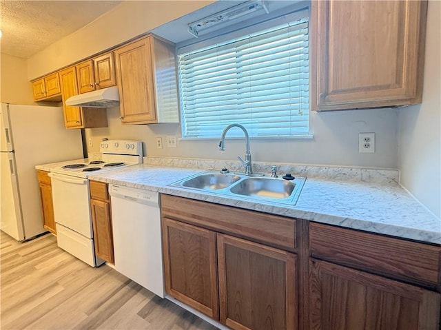 296 Country Club Dr, Jonesboro, GA 30238 - kitchen with white appliances, a sink, light wood-style flooring, light countertops, and under cabinet range hood