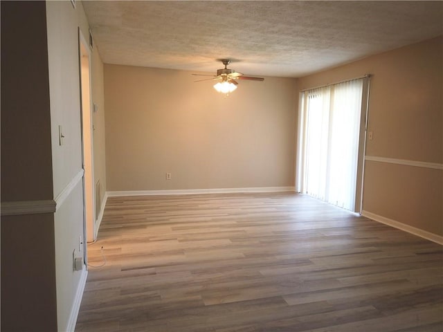 296 Country Club Dr, Jonesboro, GA 30238 - spare room with a ceiling fan, a textured ceiling, wood finished floors, and baseboards