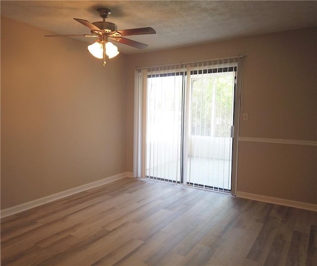 296 Country Club Dr, Jonesboro, GA 30238 - unfurnished room with a ceiling fan, wood finished floors, and baseboards