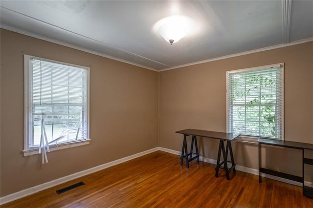 600 Forrest Rd, Fort Oglethorpe, GA 30742 - unfurnished room with wood finished floors, plenty of natural light, and crown molding