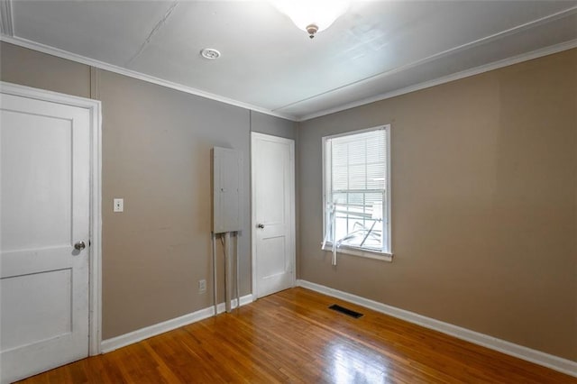 600 Forrest Rd, Fort Oglethorpe, GA 30742 - unfurnished bedroom featuring wood finished floors and crown molding