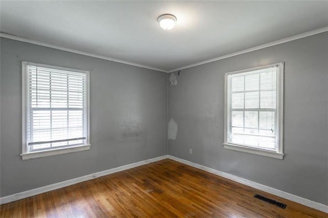 600 Forrest Rd, Fort Oglethorpe, GA 30742 - unfurnished room featuring wood finished floors, plenty of natural light, and ornamental molding