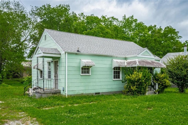 600 Forrest Rd, Fort Oglethorpe, GA 30742 - view of side of home with a shingled roof and a lawn