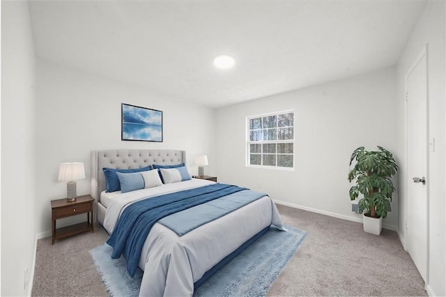 bedroom with light colored carpet