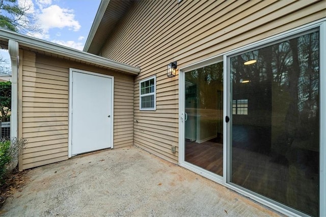 doorway to property with a patio