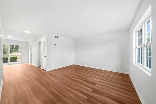 empty room featuring hardwood / wood-style floors