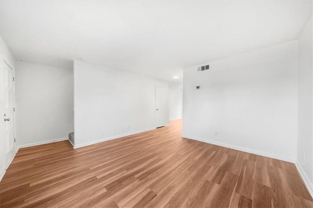 spare room with light wood-type flooring