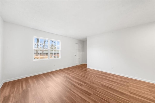 unfurnished room featuring hardwood / wood-style flooring