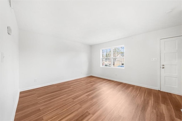 unfurnished room featuring wood-type flooring