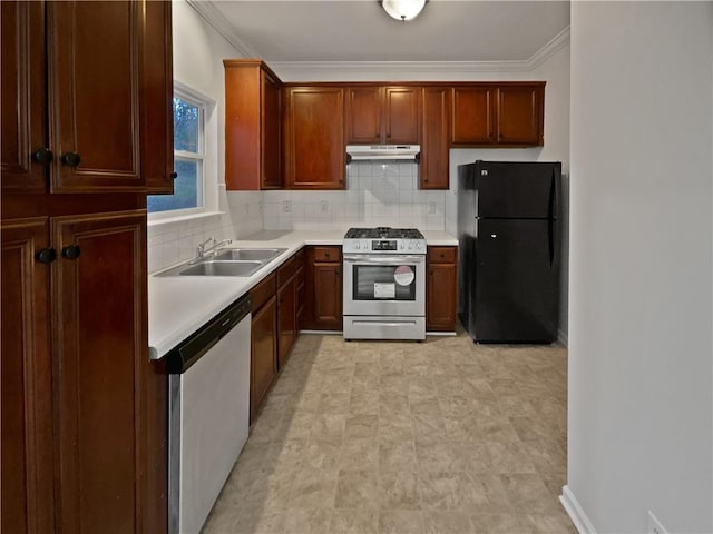 kitchen with tasteful backsplash, stainless steel range with gas cooktop, under cabinet range hood, dishwasher, and freestanding refrigerator