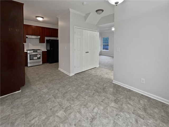 interior space featuring freestanding refrigerator, ornamental molding, under cabinet range hood, stainless steel gas stove, and backsplash