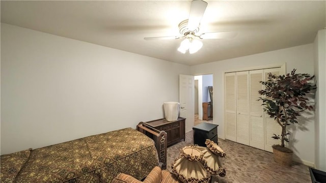 carpeted bedroom featuring a ceiling fan and a closet