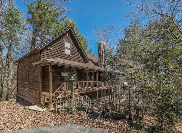 view of front of house featuring a chimney