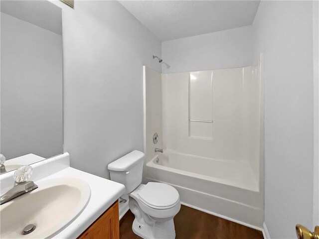 2397 Charleston Ter, Decatur, GA 30034 - full bath with bathing tub / shower combination, vanity, wood finished floors, and toilet