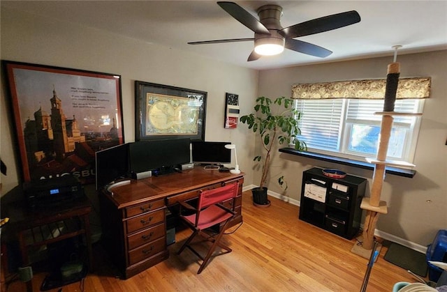 2479 Landeau Cir, Tucker, GA 30084 - home office featuring light wood-style flooring, ceiling fan, and baseboards