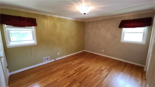 2479 Landeau Cir, Tucker, GA 30084 - unfurnished room featuring light wood-style flooring, baseboards, and crown molding