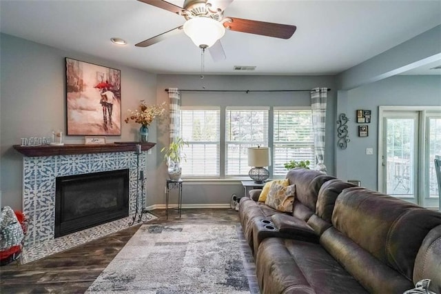 7835 Keepsake Ln, Flowery Branch, GA 30542 - living room with a premium fireplace, wood finished floors, ceiling fan, and baseboards