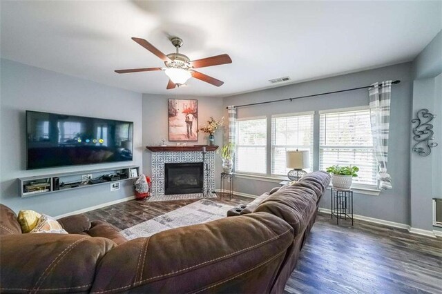 7835 Keepsake Ln, Flowery Branch, GA 30542 - living room with baseboards, wood finished floors, a ceiling fan, and a tile fireplace