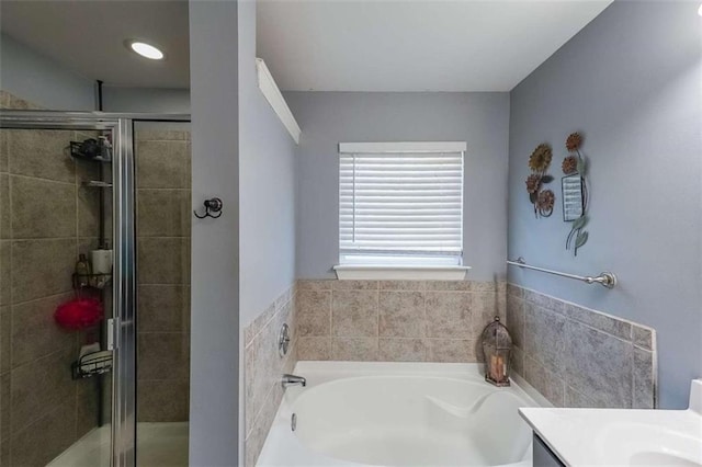 7835 Keepsake Ln, Flowery Branch, GA 30542 - bathroom with a stall shower, a bath, and vanity